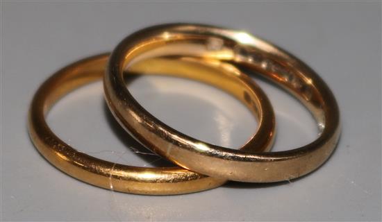 A 22ct gold wedding band and a 9ct gold wedding band,